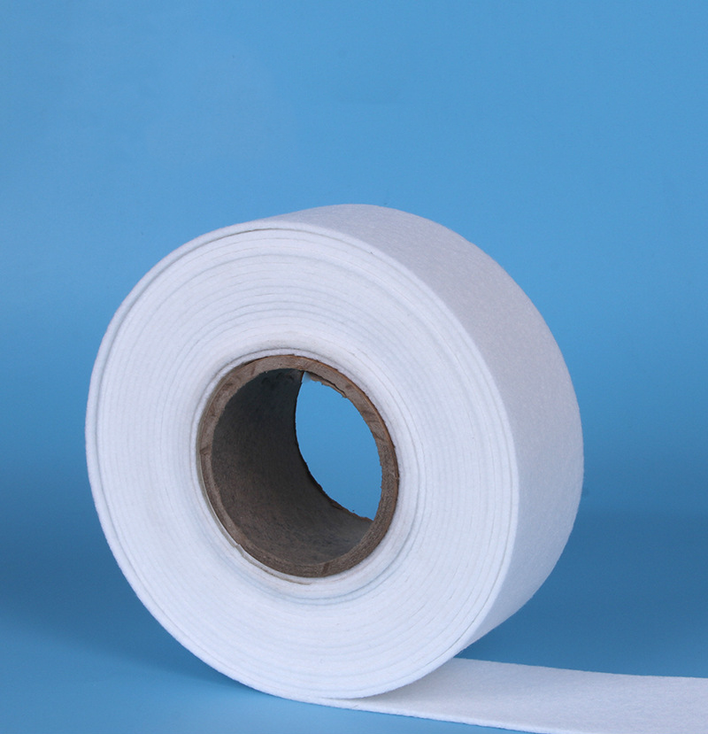 Multi-purpose white needle-punched non-woven fabric sample showing applications from automotive sound insulation and heat barriers to geotextiles and furniture cushioning.