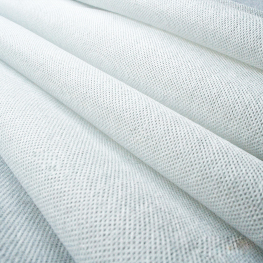 White spunlace non-woven fabric roll, soft and lint-free, suitable for wet wipes, facial masks, kitchen towels, disposable bed sheets, pillowcases, towels, medical bandages, and packaging applications.