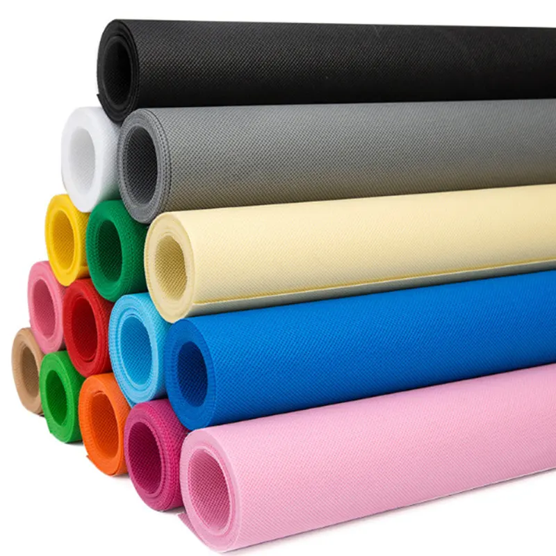 Sample display of colored PP spunbond nonwoven fabrics in green, white, yellow,blue,pink,red,brown,beigeand black for coffee bag production
