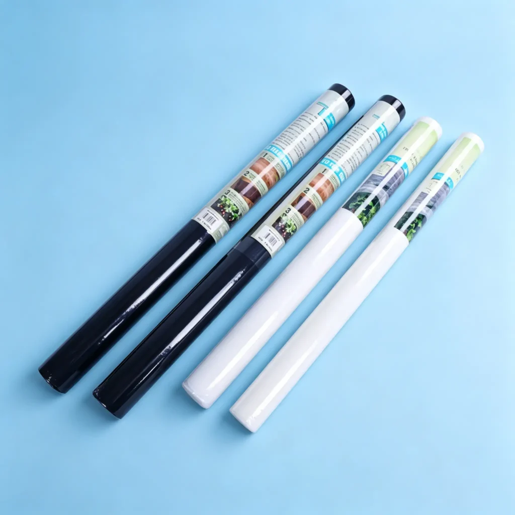 Individually packed small rolls of black & white PET spunbond non-woven fabric for household retail use