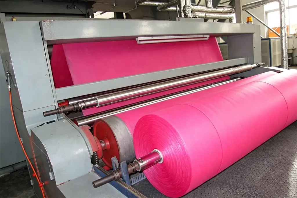 Production machine winding Takewind red PP spunbond nonwoven interlining fabric for suitcase and bags