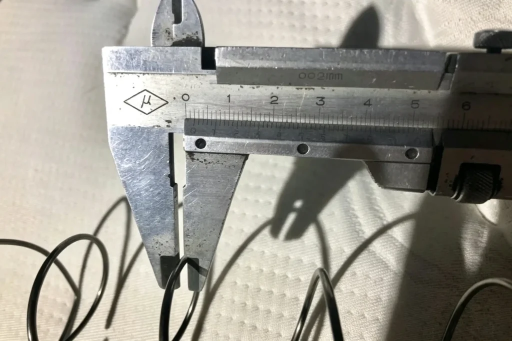 Vernier caliper measuring wire gauge of pocket spring, custom spring wire diameter from Takewind