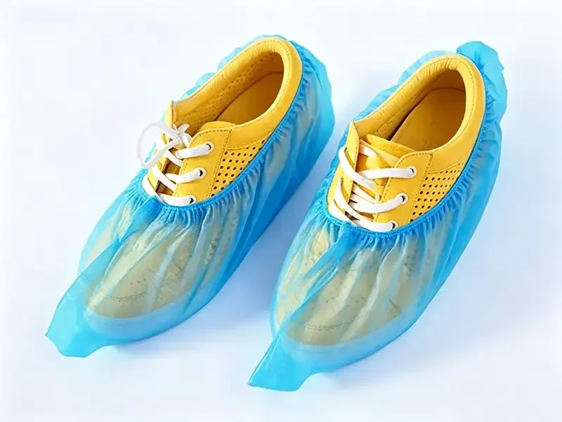 Blue disposable non woven shoe covers made of PP spunbond fabric, raw material from Takewind nonwoven factory