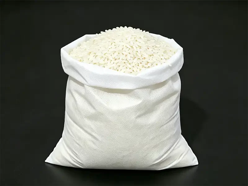 white breathable non woven bag filled with long grain rice, food-grade nonwoven rice packaging sack, Takewind grain packing nonwoven fabric